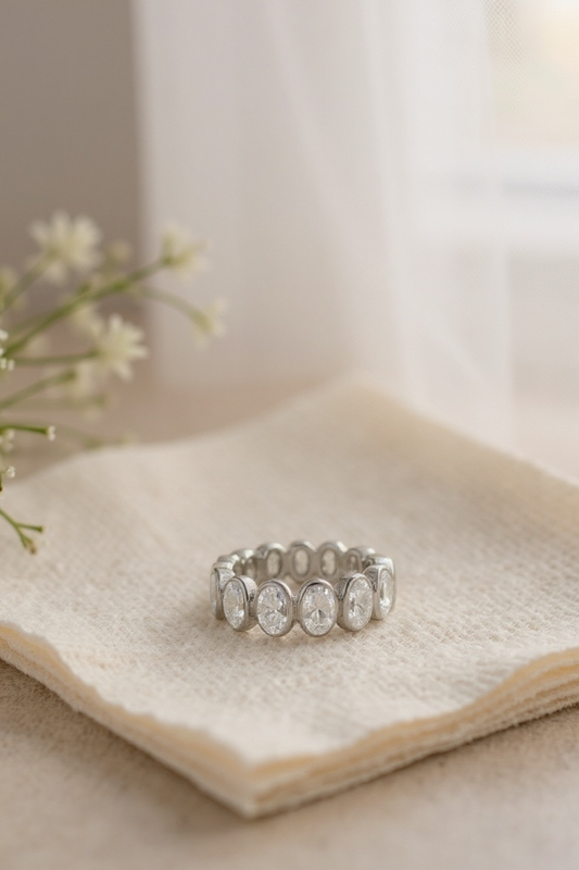 Oval bezel eternity band